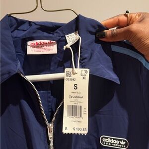 adidas navy jumpsuit with light blue stripes